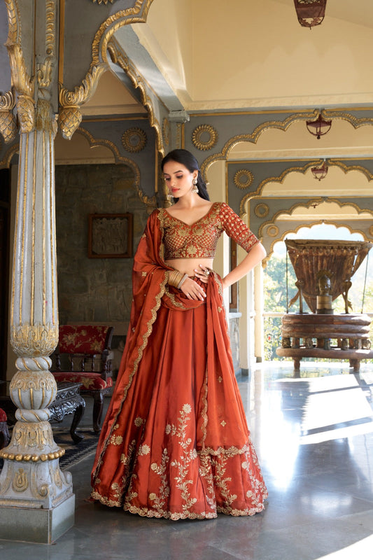 Imposing Heavy Rangoli Silk Orange Color Lehenga Choli