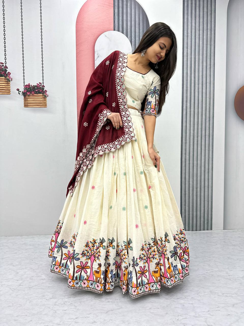 Delightful Embroidery Work Cream Color Lehenga With Maroon Dupatta