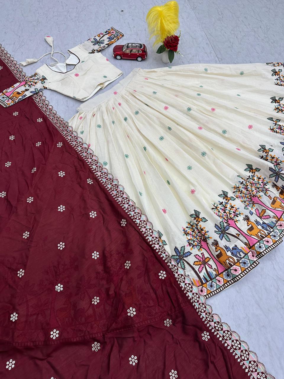 Delightful Embroidery Work Cream Color Lehenga With Maroon Dupatta